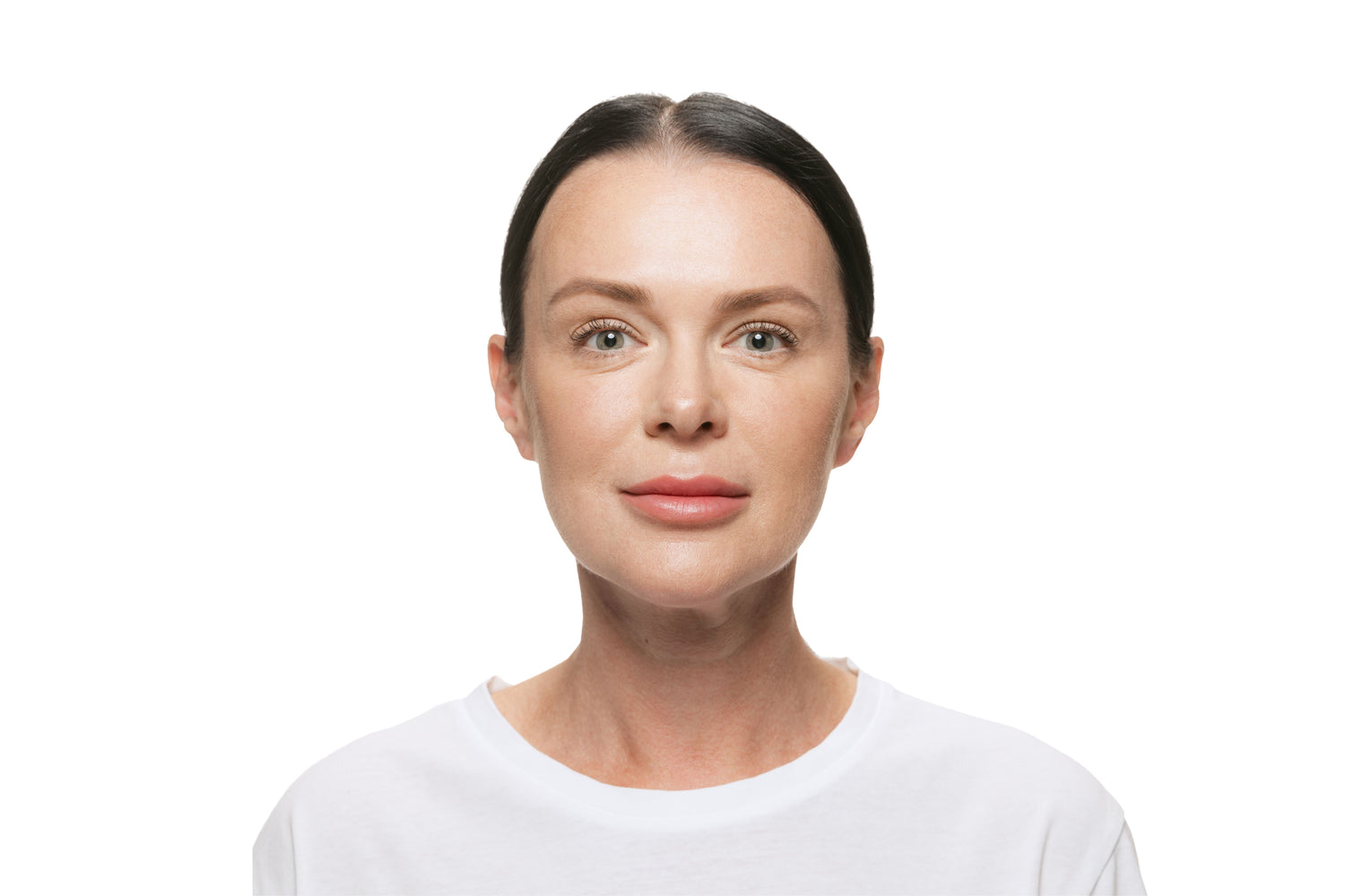 Woman in her forties in a white t-shirt, looking at camera